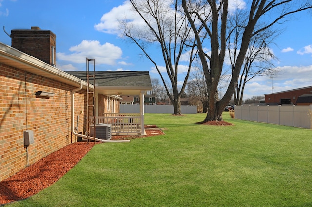 view of yard with central AC unit