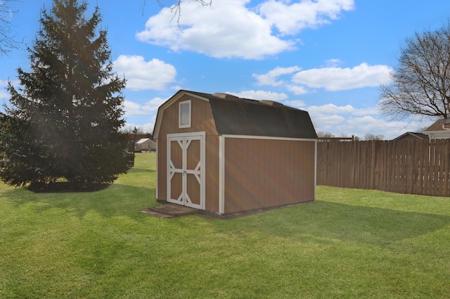 view of outdoor structure featuring a yard