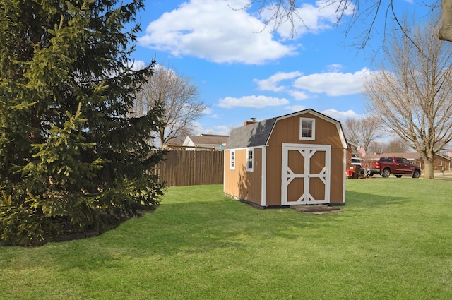 view of outdoor structure featuring a lawn