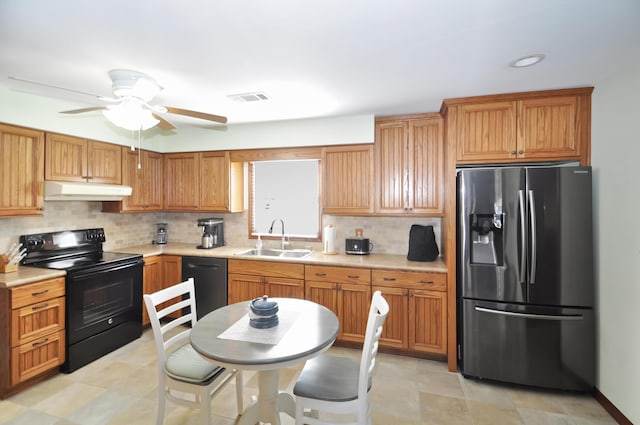 kitchen featuring tasteful backsplash, ceiling fan, sink, and black appliances