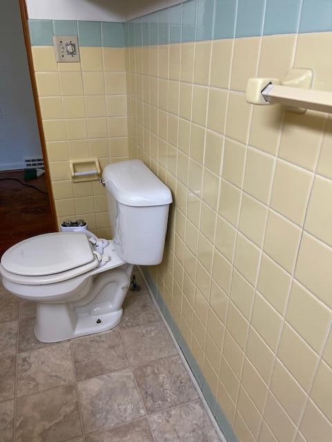 1401 E Home Rd, Springfield, OH 45503 - bathroom with tile walls and toilet