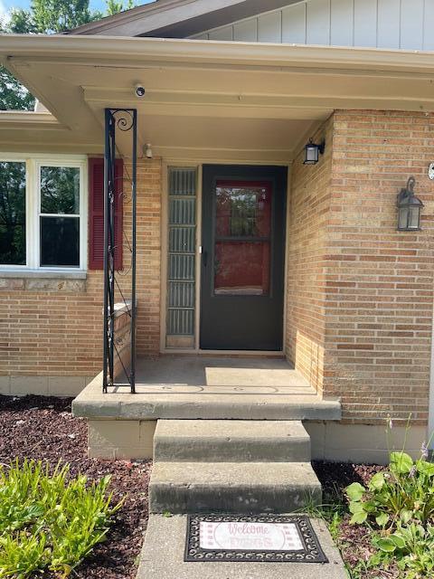 1401 E Home Rd, Springfield, OH 45503 - entrance to property featuring brick siding and board and batten siding