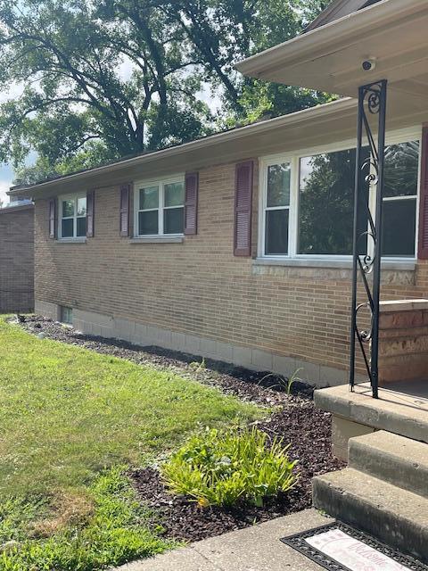 1401 E Home Rd, Springfield, OH 45503 - view of property exterior with brick siding and a lawn