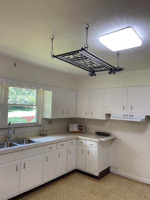 1401 E Home Rd, Springfield, OH 45503 - kitchen featuring white cabinets and light countertops