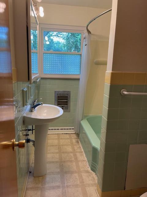 1401 E Home Rd, Springfield, OH 45503 - bathroom with tile walls, shower / tub combination, and tile patterned floors