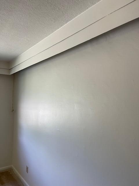 1401 E Home Rd, Springfield, OH 45503 - detailed view of a textured ceiling and baseboards