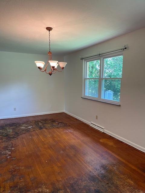 1401 E Home Rd, Springfield, OH 45503 - empty room with a chandelier and hardwood / wood-style flooring