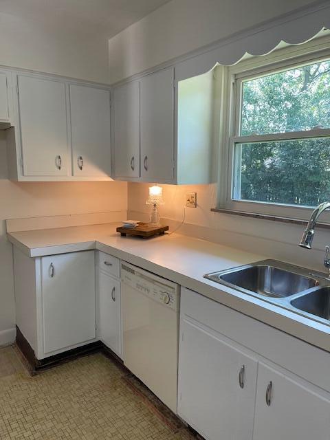 1401 E Home Rd, Springfield, OH 45503 - kitchen with dishwasher, light countertops, and white cabinets