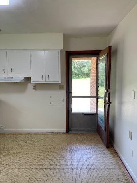 1401 E Home Rd, Springfield, OH 45503 - kitchen with white cabinetry and baseboards