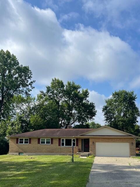1401 E Home Rd, Springfield, OH 45503 - ranch-style home featuring a garage, driveway, and a front yard