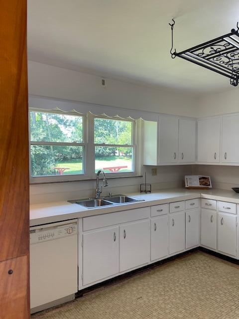 1401 E Home Rd, Springfield, OH 45503 - kitchen with white dishwasher, white cabinetry, and light countertops