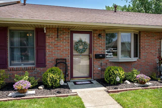 4212 Midfield St, Springfield, OH 45503 - doorway to property with brick siding and roof with shingles