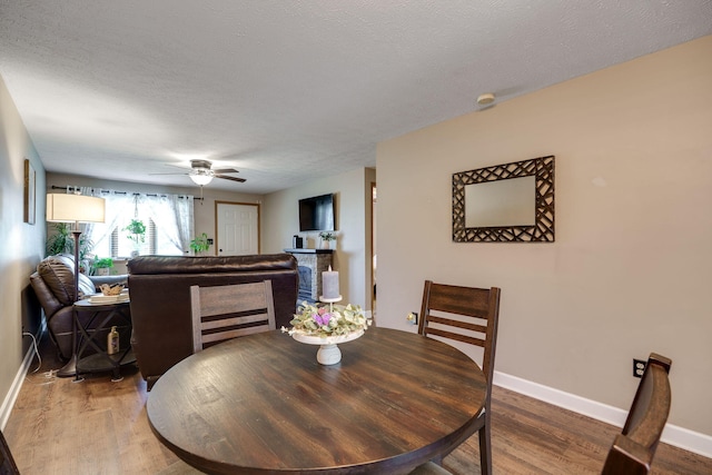 4212 Midfield St, Springfield, OH 45503 - dining space with ceiling fan, wood finished floors, and a textured ceiling