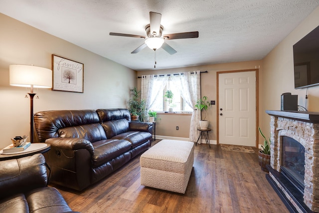 4212 Midfield St, Springfield, OH 45503 - living room with a ceiling fan, wood finished floors, and a stone fireplace