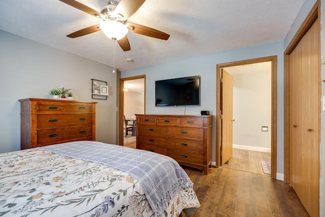 4212 Midfield St, Springfield, OH 45503 - bedroom featuring wood finished floors, a closet, and a ceiling fan