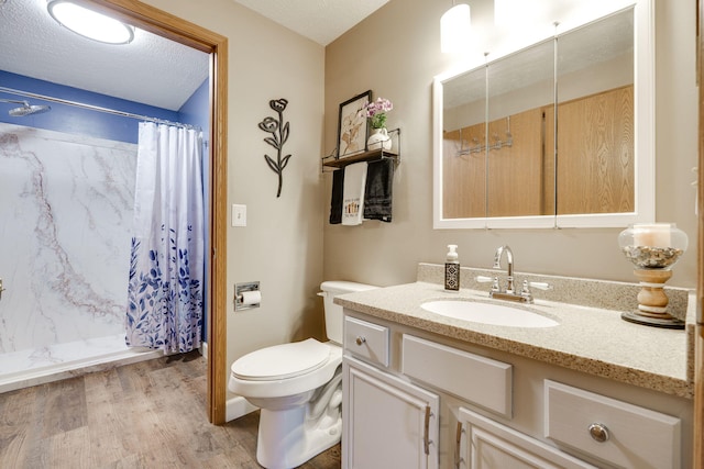 4212 Midfield St, Springfield, OH 45503 - bathroom featuring vanity, wood finished floors, a shower with shower curtain, and a textured ceiling