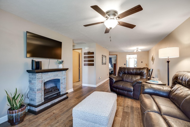 4212 Midfield St, Springfield, OH 45503 - living room with a ceiling fan, wood finished floors, and a fireplace