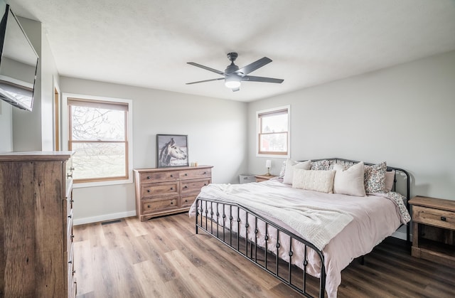 bedroom featuring ceiling fan and light wood-type flooring