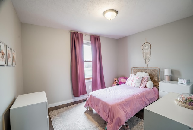 bedroom with hardwood / wood-style flooring