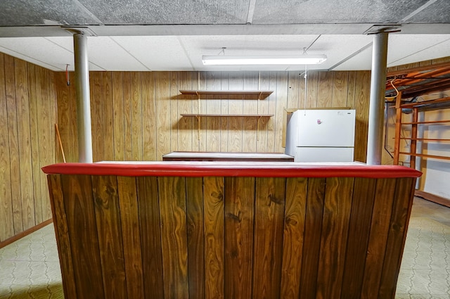 2831 Wellsford Ln, Springfield, OH 45503 - indoor dry bar featuring freestanding refrigerator and wood walls