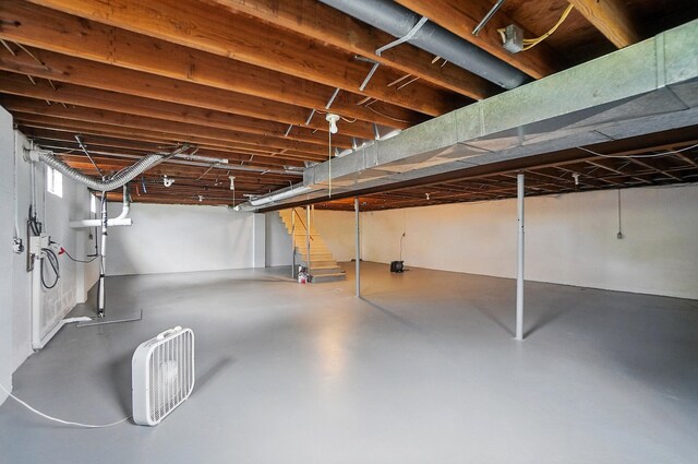 unfinished basement with stairway