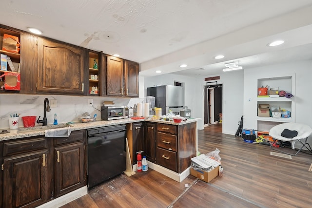 1566 Cora St, Springfield, OH 45503 - kitchen with stainless steel appliances, a sink, open shelves, dark wood finished floors, and a peninsula