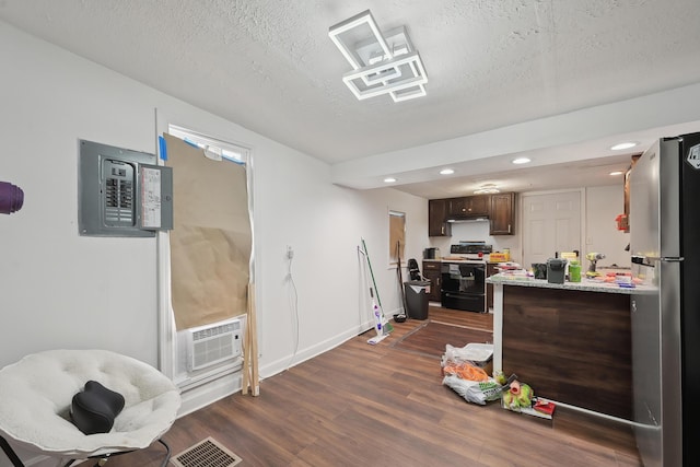 1566 Cora St, Springfield, OH 45503 - dining space featuring dark wood-style flooring, electric panel, a textured ceiling, recessed lighting, and baseboards
