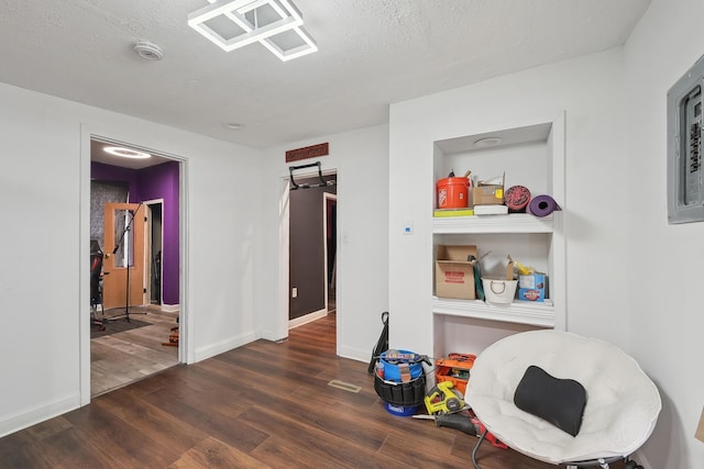 1566 Cora St, Springfield, OH 45503 - rec room with wood finished floors, a textured ceiling, and baseboards