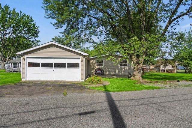 garage with a lawn