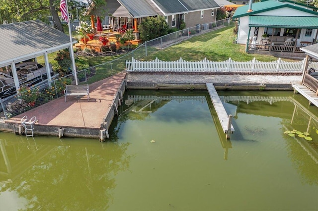 dock area featuring a yard and a water view