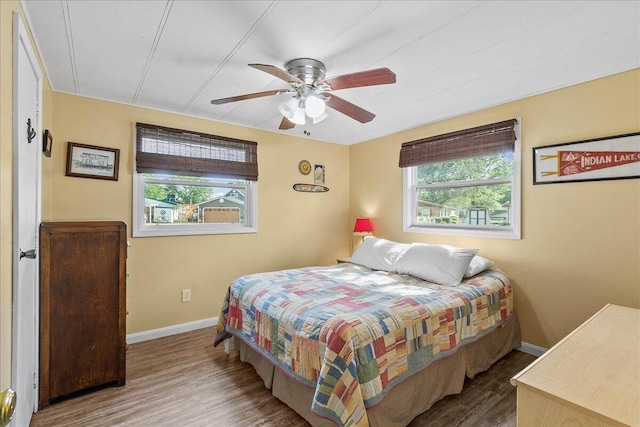 bedroom with hardwood / wood-style flooring and ceiling fan