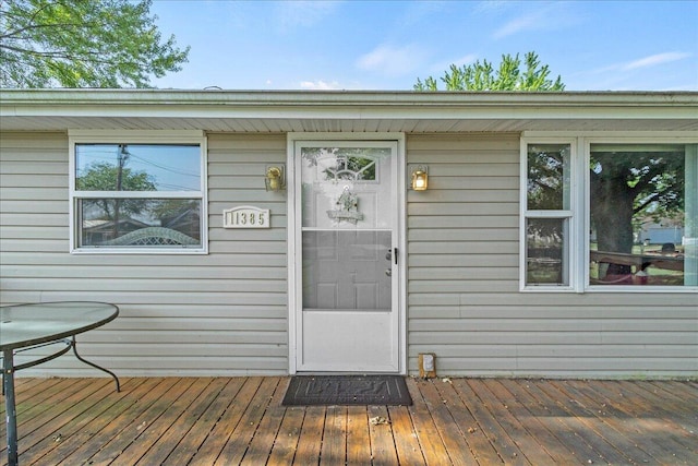 entrance to property with a deck