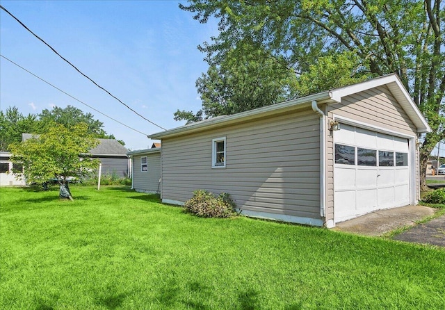 garage featuring a lawn