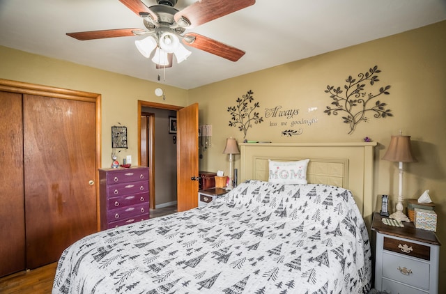 bedroom featuring a closet, ceiling fan, and wood finished floors