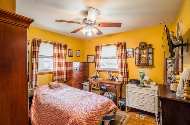 bedroom featuring ceiling fan and wood finished floors