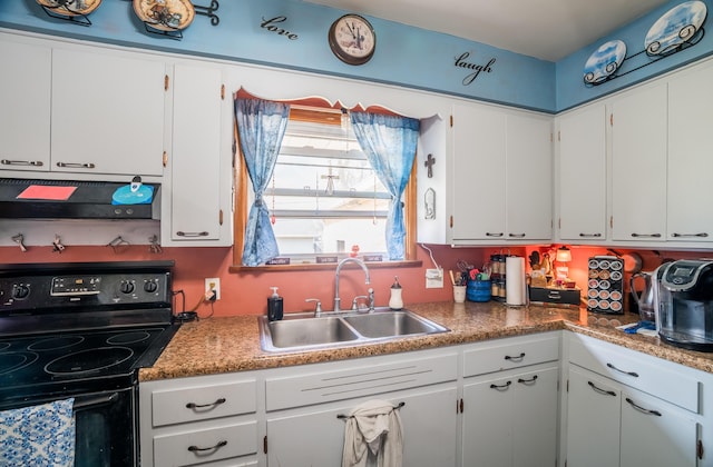 kitchen featuring black electric range, white cabinetry, under cabinet range hood, and a sink