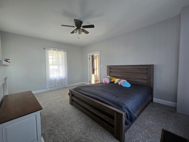 bedroom with a fireplace, ceiling fan, and carpet flooring