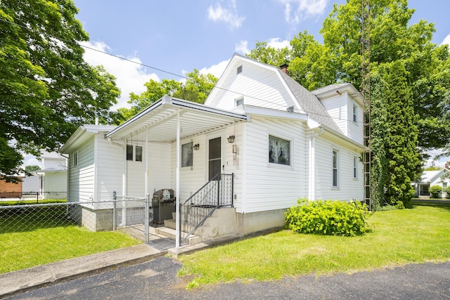 312 E Buckeye St, Belle Center, OH 43310 - dutch colonial with a chimney and roof with shingles