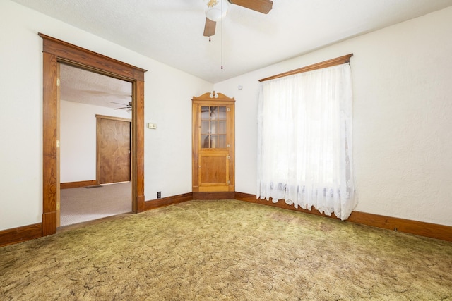 312 E Buckeye St, Belle Center, OH 43310 - empty room with a ceiling fan, carpet floors, and baseboards