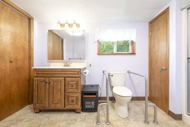 312 E Buckeye St, Belle Center, OH 43310 - bathroom featuring vanity, toilet, and baseboards