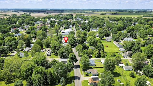 312 E Buckeye St, Belle Center, OH 43310 - aerial view of residential area with a tree filled landscape