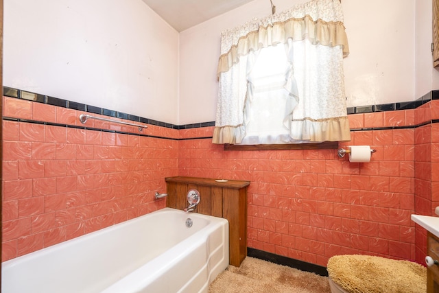 312 E Buckeye St, Belle Center, OH 43310 - bathroom featuring tile walls, a bath, and wainscoting