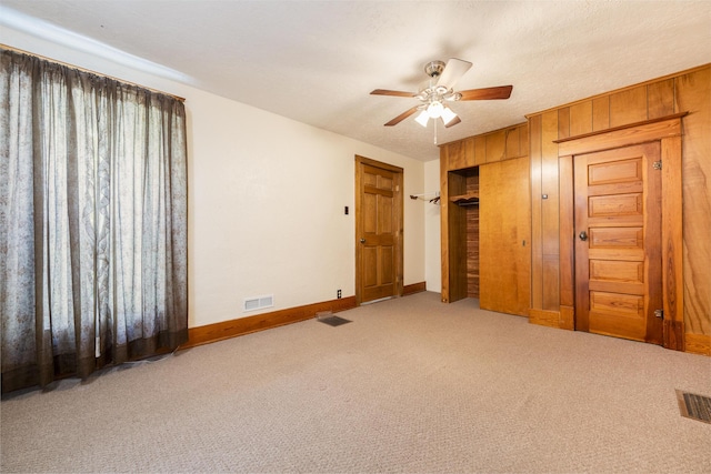 312 E Buckeye St, Belle Center, OH 43310 - unfurnished bedroom featuring carpet, baseboards, ceiling fan, and a closet