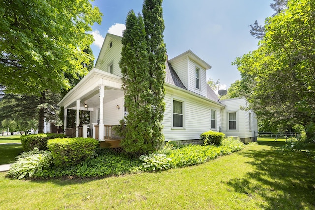 312 E Buckeye St, Belle Center, OH 43310 - view of side of home featuring a porch