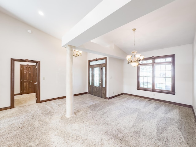 spare room with a notable chandelier, light carpet, baseboards, lofted ceiling, and decorative columns