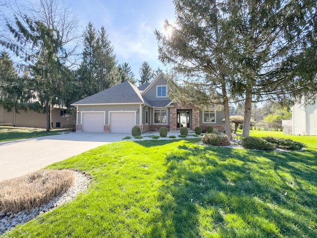 craftsman-style home featuring a shingled roof, concrete driveway, an attached garage, brick siding, and a front yard
