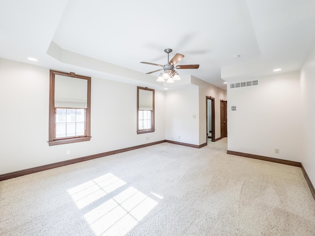 empty room featuring recessed lighting, visible vents, a ceiling fan, baseboards, and light colored carpet