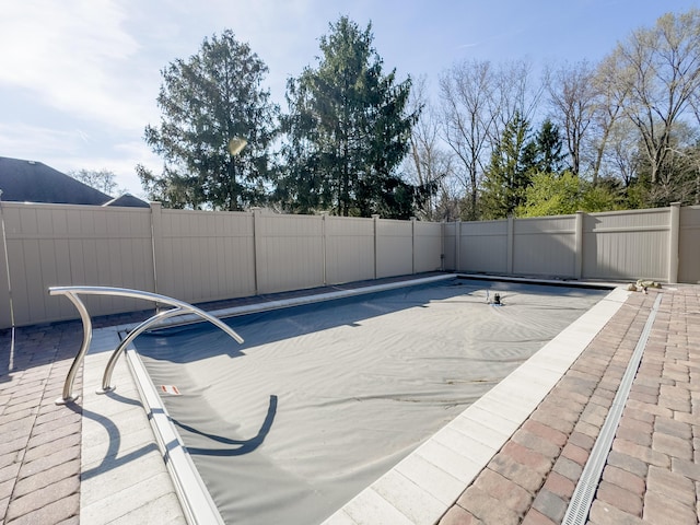 view of swimming pool with fence