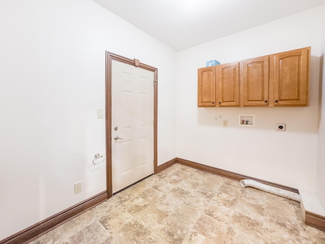 laundry room with stone finish floor, hookup for an electric dryer, baseboards, cabinet space, and washer hookup