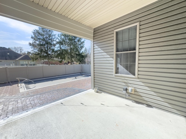 view of patio featuring fence